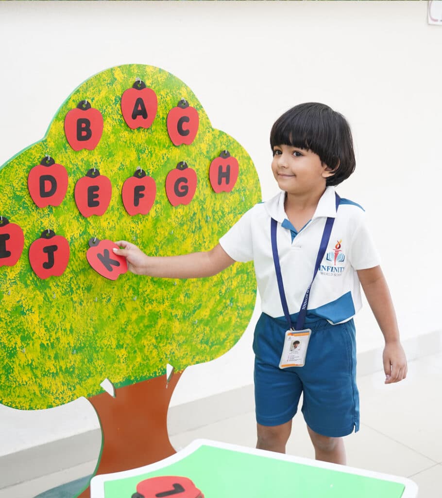 Child engaging in alphabet activity at Infinity World School, CBSE preschool in Chanda Nagar.